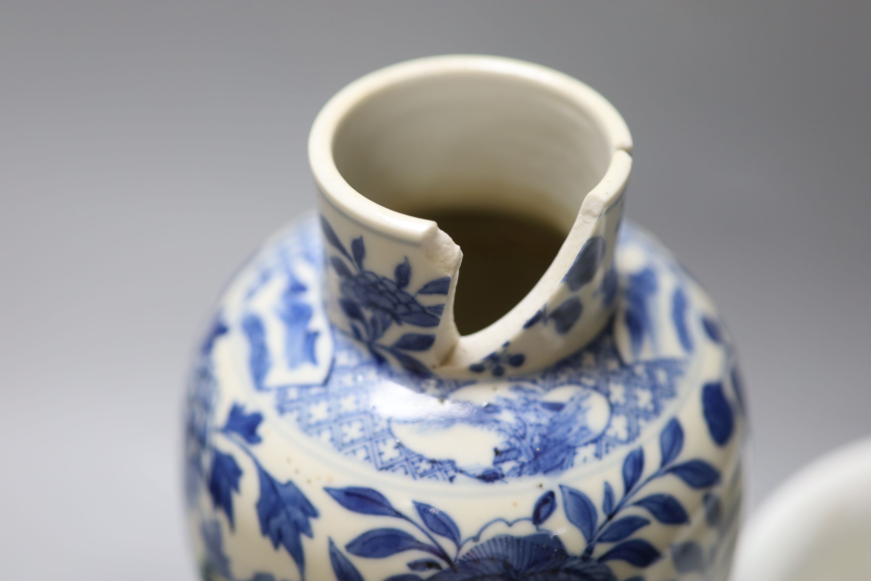 A Chinese blue and white dragon vase with Kangxi mark, together with a blue and white jardiniere and a celadon glazed bowl